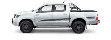 White Toyota HiLux dual-cab ute with a sports bar and tonneau cover